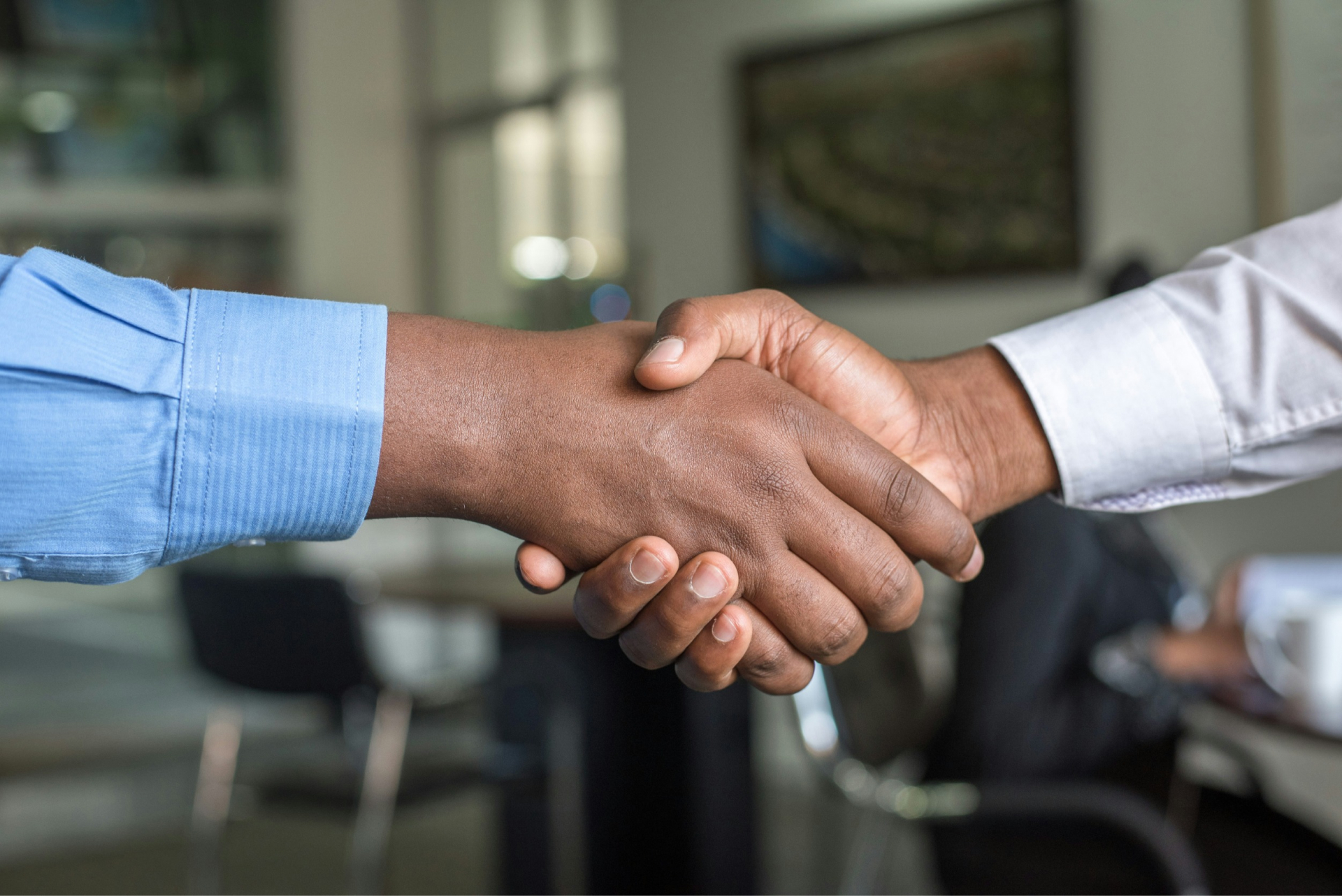 image showing two people shaking hands